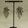 Boucles d'oreilles origami en forme de feuille couleur vert pâle avec motifs jaunes